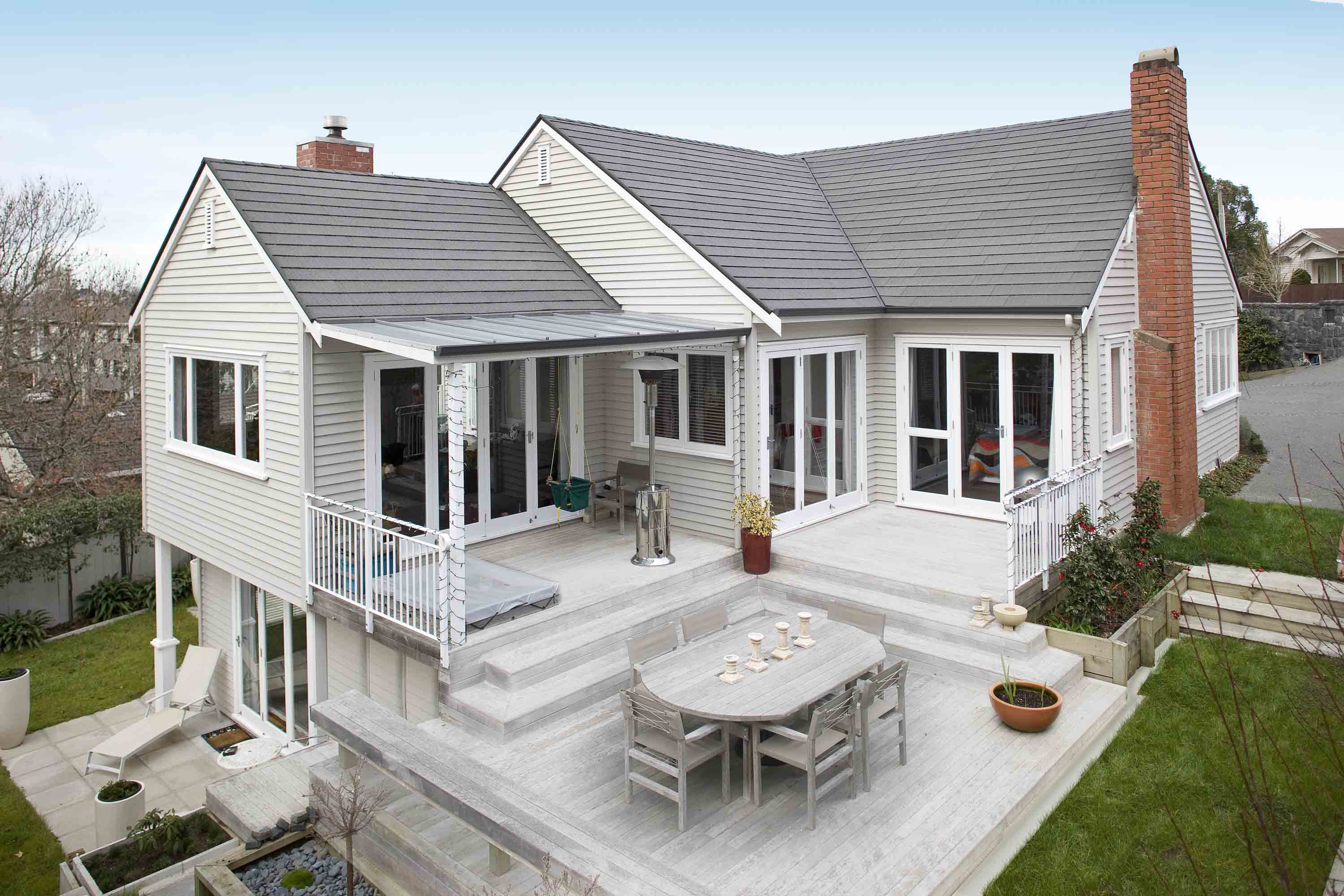 Weatherboard home renovated with CF Slate metal roof. Looking back over entertaining area.